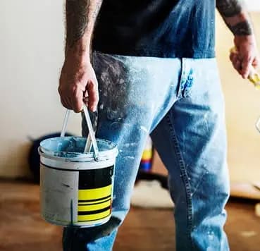Professional painter working on the wall